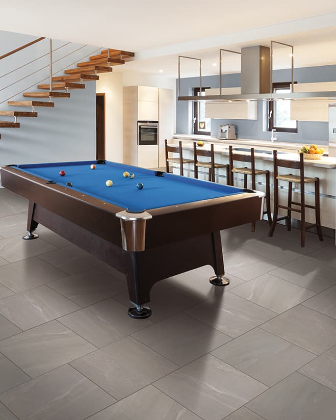 basement recreation space with tile flooring, a pool table and kitchen